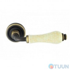 Linea Cali handle, Dalia, on 103 round rosette, matte bronze/porcelain